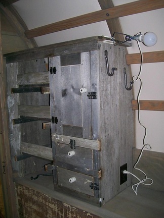 32. Barnwood cabinet with outlet