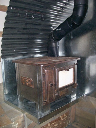 33. Stove on bench with corrugated heat shields