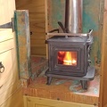 150.  ship stove, kindling box under, copper heat shields with patina