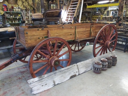 restored single sided farm wagon  with old side board and hubs